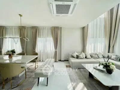 Luxurious modern living room with elegant decor and ample natural light