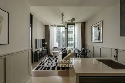 Modern living room with stylish decor and city view, featuring sleek furniture and contemporary design.