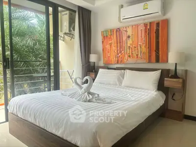 Cozy bedroom with balcony access and stylish decor in modern apartment