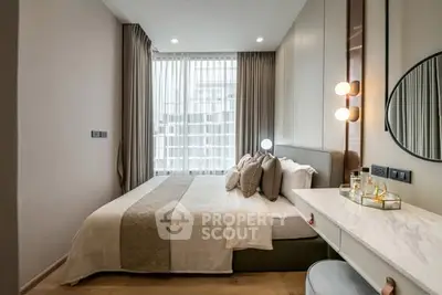 Elegant bedroom with modern decor, large window, and stylish lighting in a contemporary apartment.