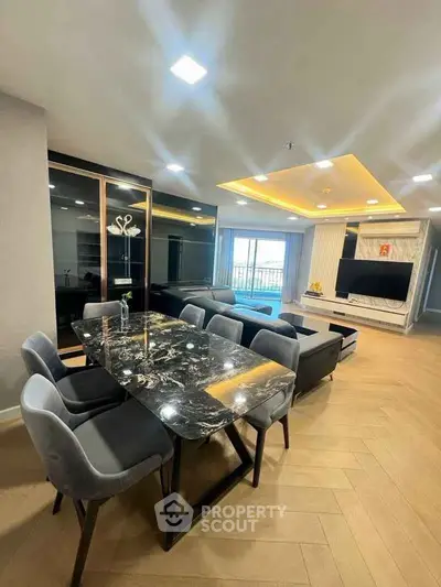 Luxurious modern living room with elegant dining area and stunning lighting design.