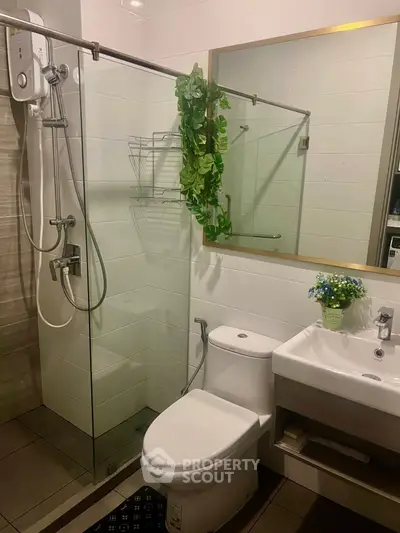 Modern bathroom with glass shower and sleek fixtures