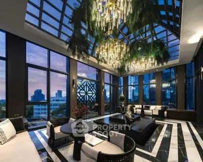 Luxurious living room with panoramic city views and elegant chandeliers