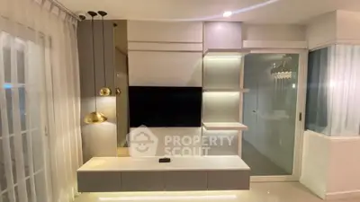 Modern living room with sleek TV unit and ambient lighting