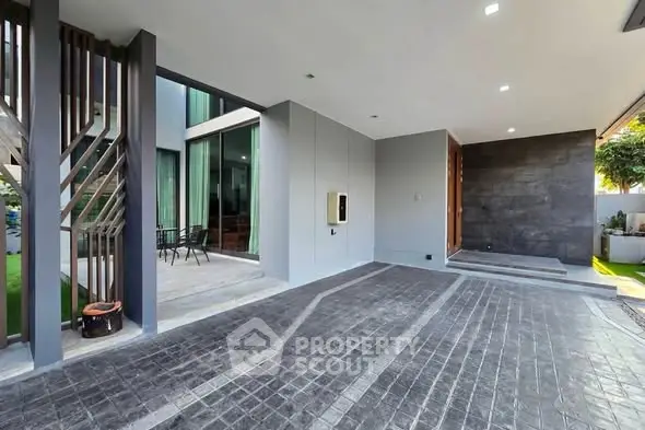 Modern home exterior with sleek design and spacious driveway