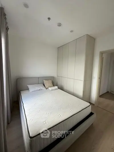 Modern bedroom with minimalist design and built-in wardrobe
