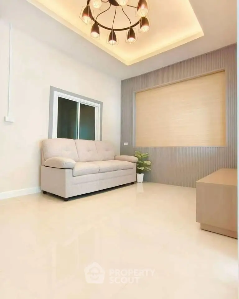 Modern living room with elegant lighting and cozy sofa in a stylish apartment.