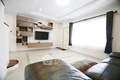 Spacious modern living room with sleek furniture and natural light
