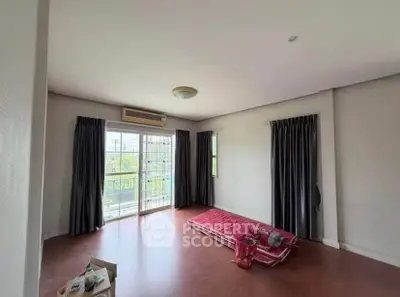 Spacious unfurnished bedroom with balcony access and natural light