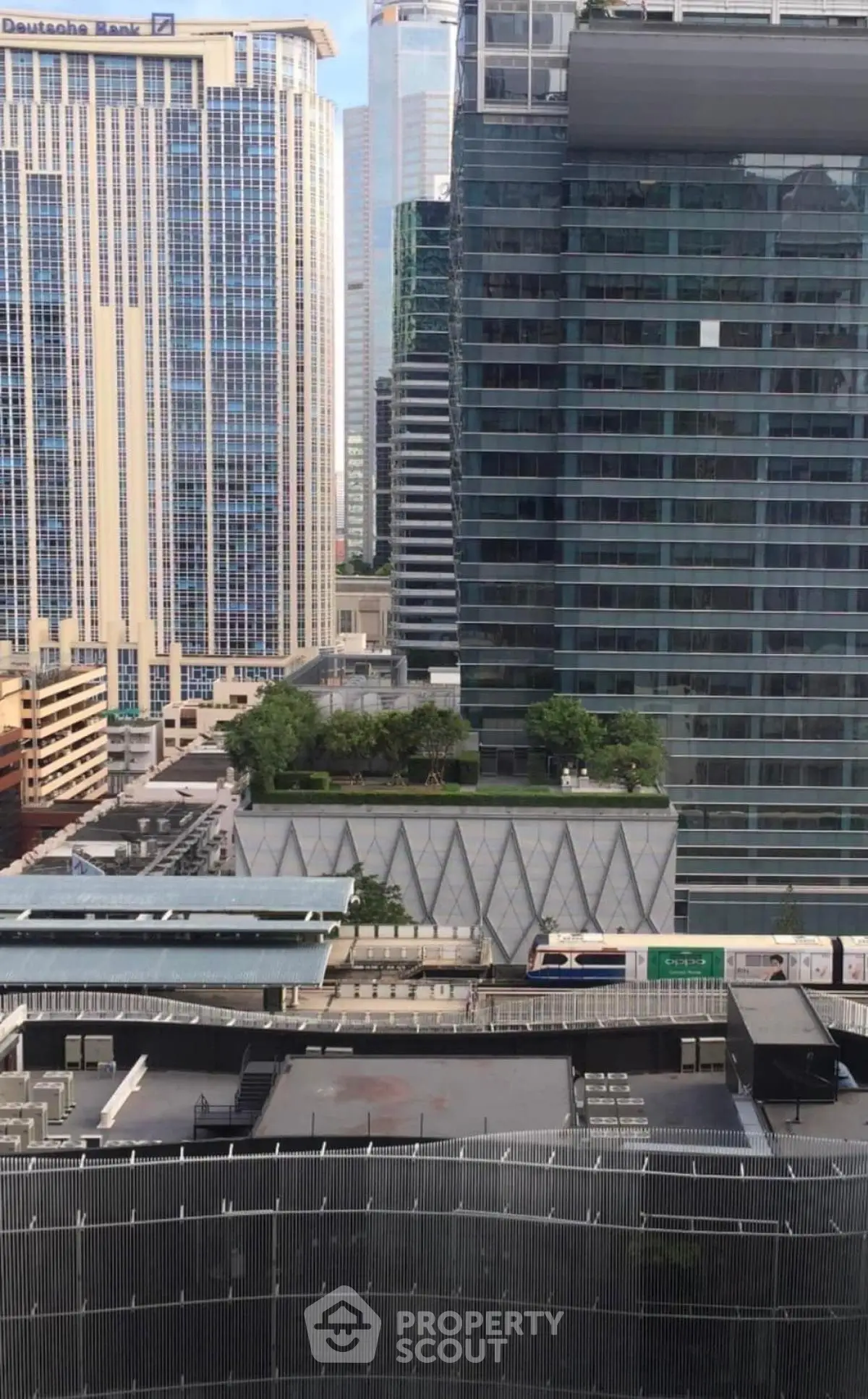 Stunning urban cityscape with modern skyscrapers and lush rooftop garden view.