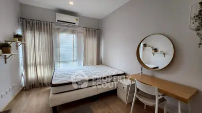 Modern bedroom with stylish decor and natural light