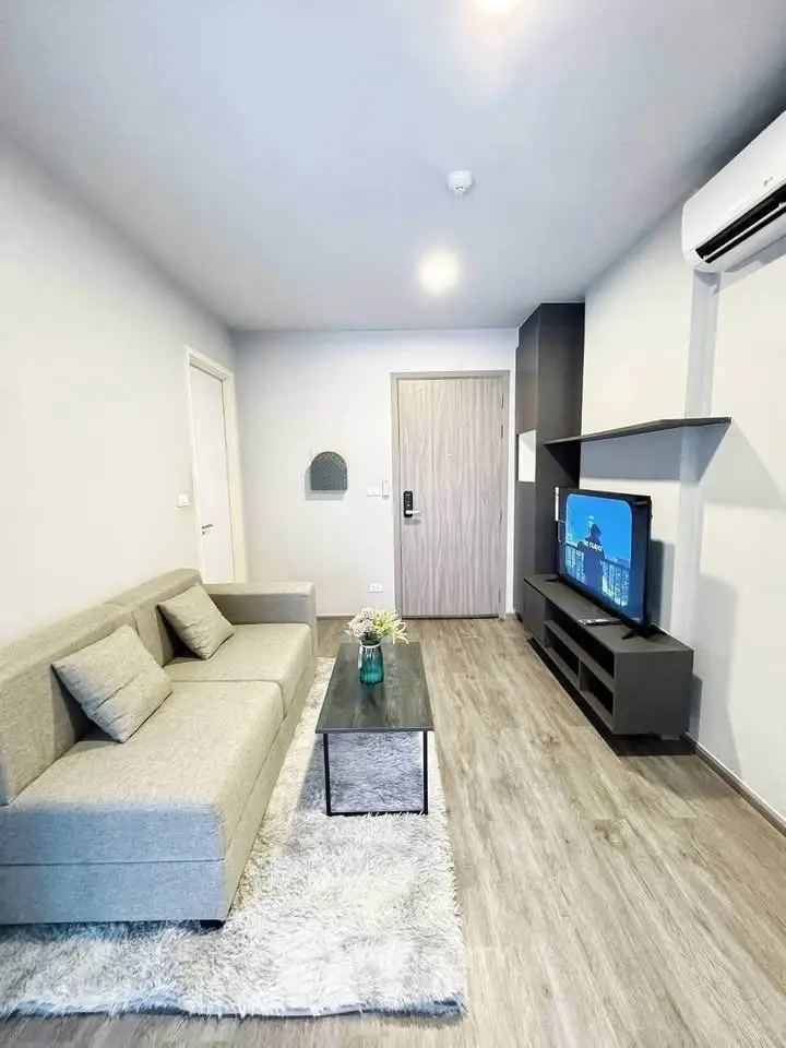 Modern living room with sleek furniture and stylish decor in a contemporary apartment.