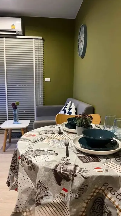 Cozy dining area with stylish decor and modern furniture in a compact living space.