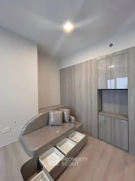 Modern living room with built-in storage and sleek design