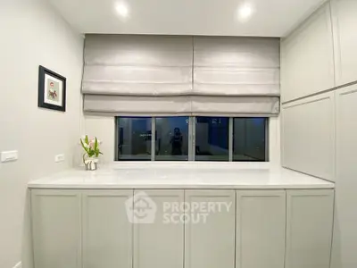 Elegant storage space with modern cabinetry and soft lighting