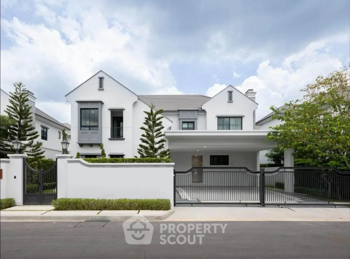 Stunning modern white house with sleek design and lush greenery, perfect for luxurious living.