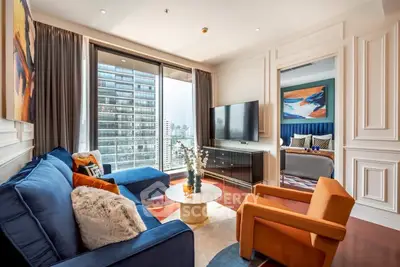 Luxurious living room with modern decor and city view, featuring plush sofas and elegant design.
