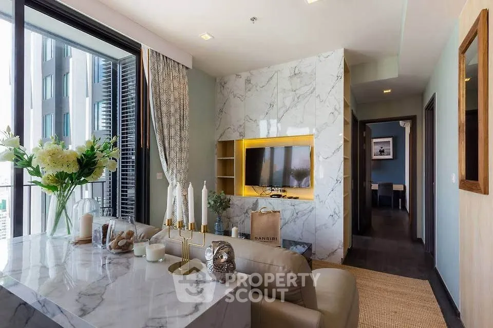 Luxurious modern living room with marble accents and city view