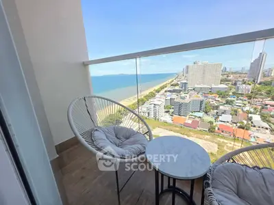 Stunning high-rise balcony with breathtaking ocean and city views, perfect for relaxation and enjoying the scenery.