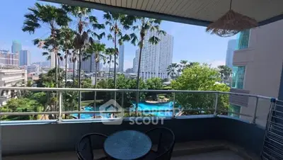 Spacious balcony with stunning city and pool view, perfect for relaxation.