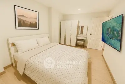 Cozy bedroom with modern decor and stylish artwork, perfect for relaxation.