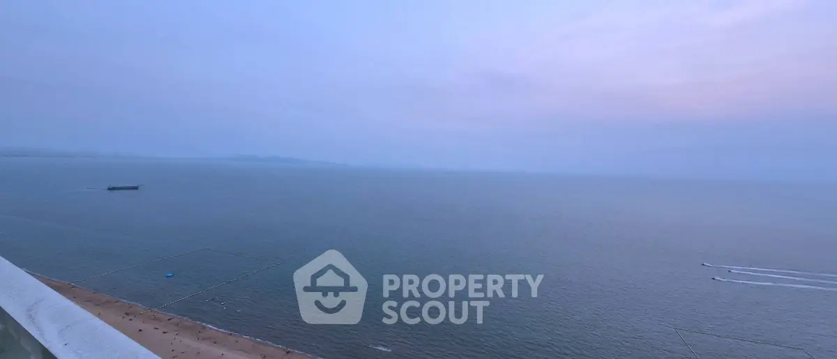Breathtaking ocean view from a high-rise balcony at sunset, perfect for serene living.