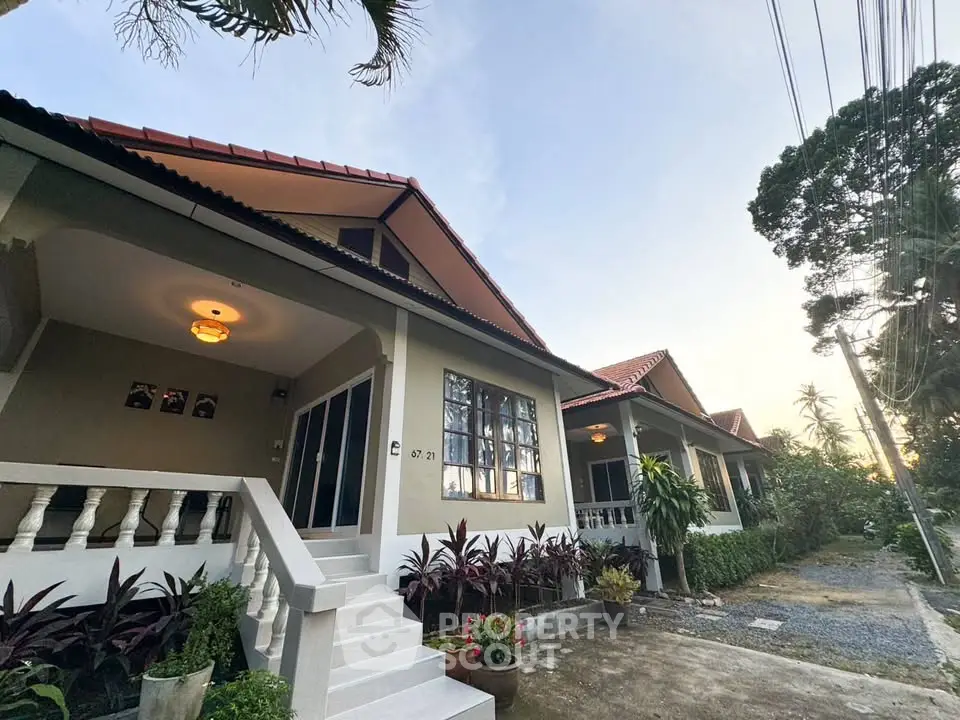 Charming suburban home with lush garden and inviting entrance, perfect for family living.