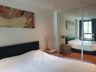 Cozy bedroom with mirrored closet and elegant decor