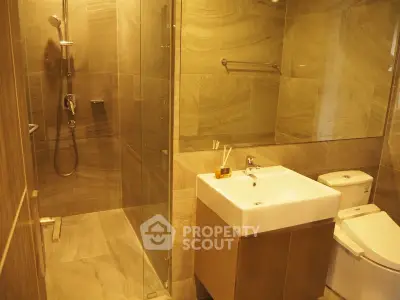Luxurious modern bathroom with elegant tile design and glass shower enclosure