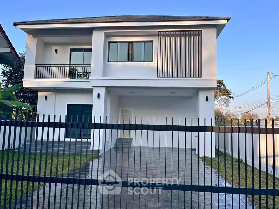 Modern two-story house with sleek design and spacious driveway
