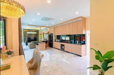 Luxurious open-plan kitchen and living area with modern design and elegant decor.