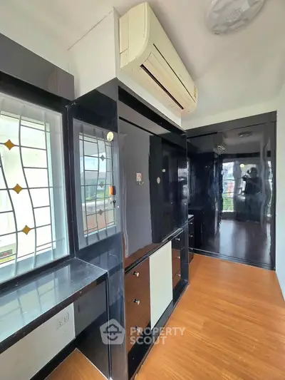 Compact study room with built-in storage and air conditioning