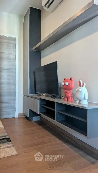 Modern living room with sleek TV stand and playful decor accents