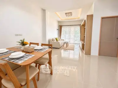 Spacious modern living room with elegant dining area and natural light
