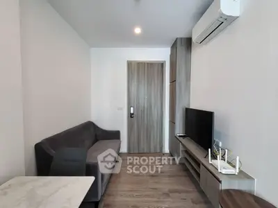 Modern living room with sleek furniture and air conditioning in a cozy apartment.