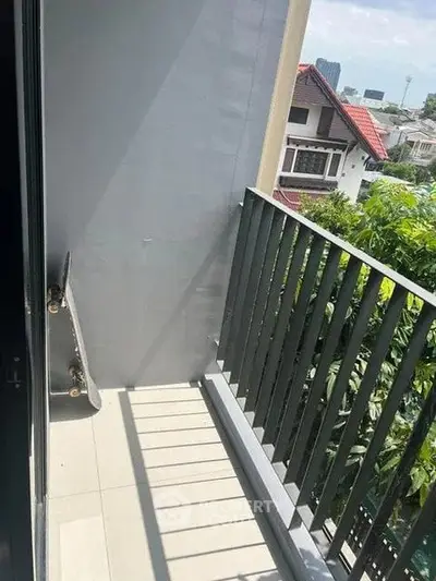 Charming balcony with city view, perfect for relaxation and enjoying the outdoors.