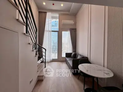Modern duplex living room with high ceilings and city view