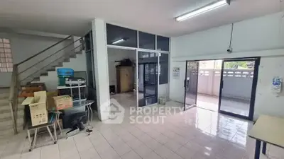 Spacious commercial space with tiled flooring and glass partitions, ideal for office or retail setup.