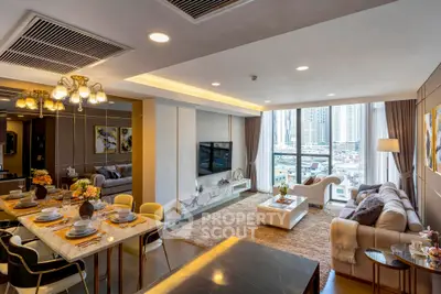 Luxurious modern living room with city view, elegant decor, and open dining area.