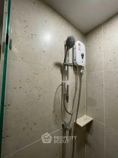 Modern bathroom shower with sleek tile design and water heater
