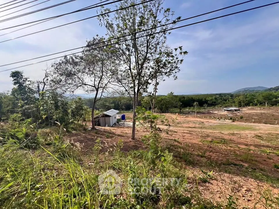 Expansive land plot with scenic views and lush greenery, perfect for development opportunities.