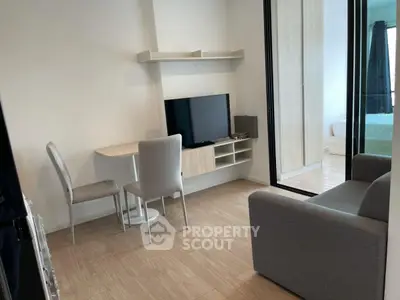 Modern compact living room with TV and cozy seating area