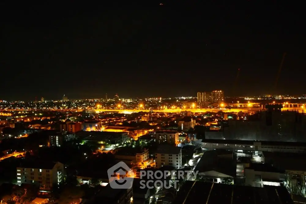 Stunning cityscape night view with illuminated skyline and vibrant lights.