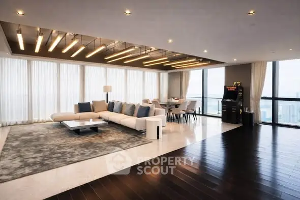 Luxurious modern living room with panoramic city views and elegant furnishings.
