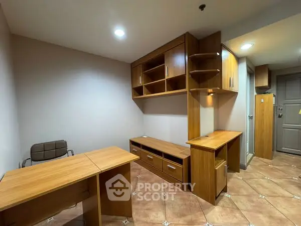 Modern study room with wooden furniture and ample storage space