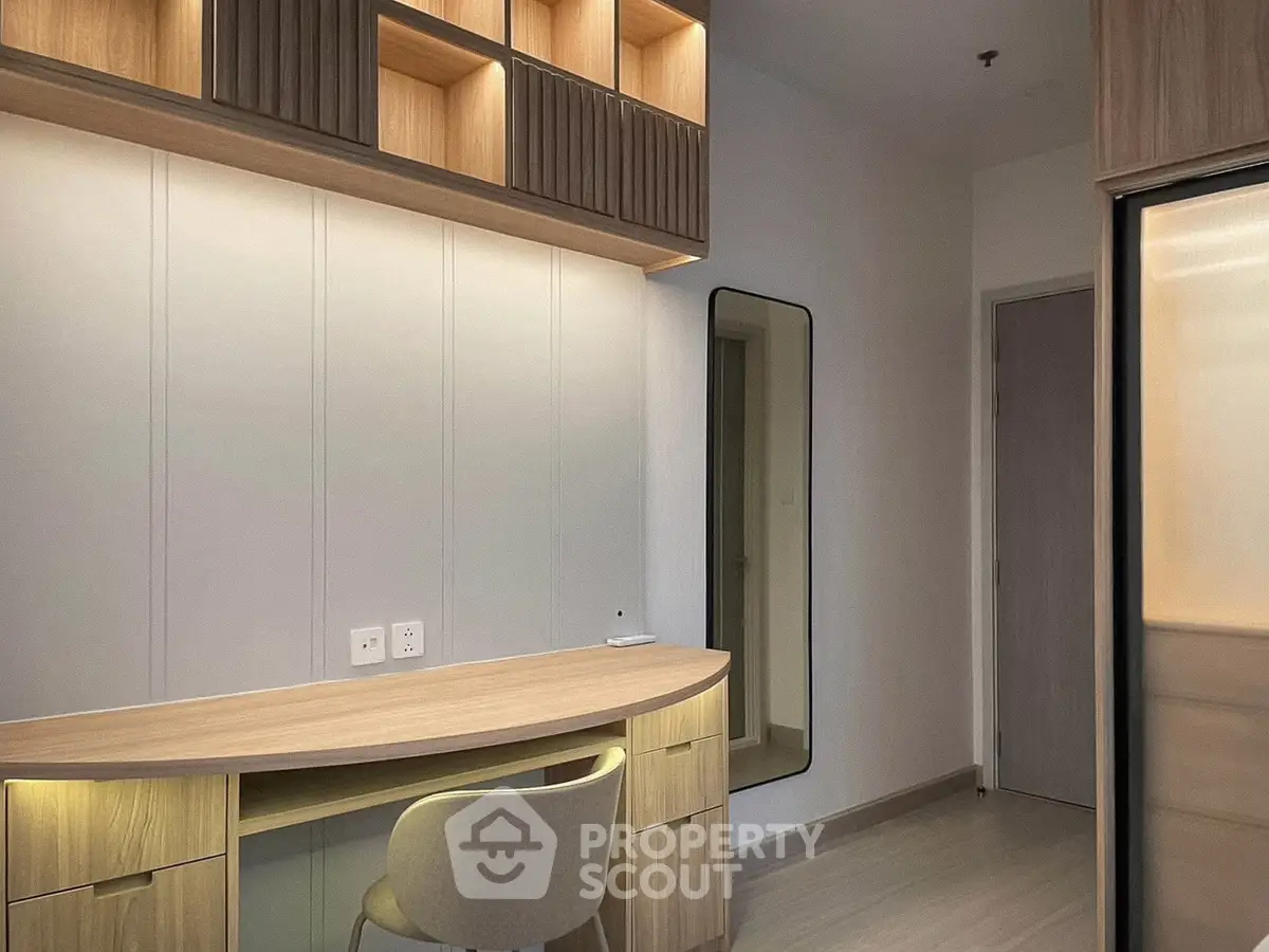 Modern study room with sleek wooden desk and built-in storage