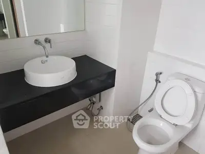 Modern bathroom with sleek white fixtures and minimalist design