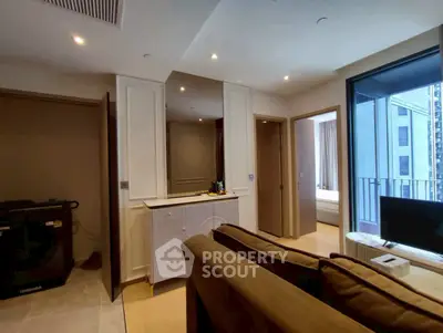 Modern living room with cozy sofa and balcony view in urban apartment