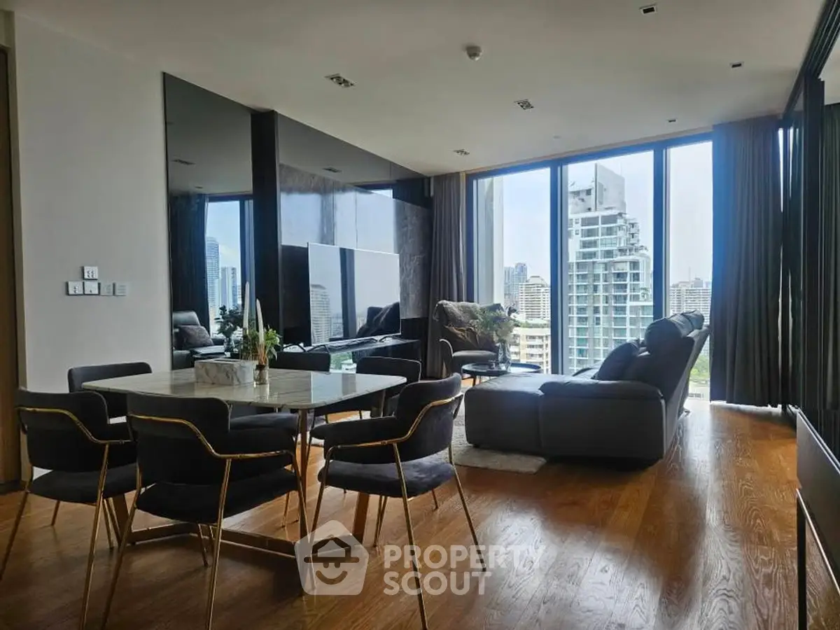 Luxurious living room with panoramic city views and elegant modern furnishings.