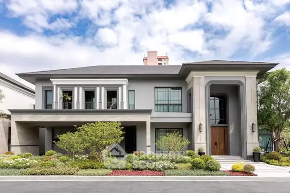 Luxurious modern two-story house with landscaped garden and elegant facade.